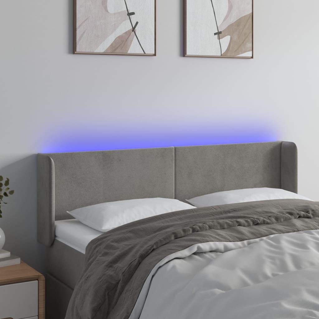 Sengegavl med LED-lys 147x16x78/88 cm fløjl lysegrå billede