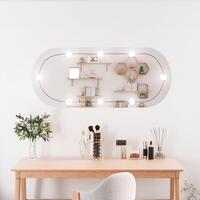 Vægspejl med LED-lys 25x60 cm oval glas