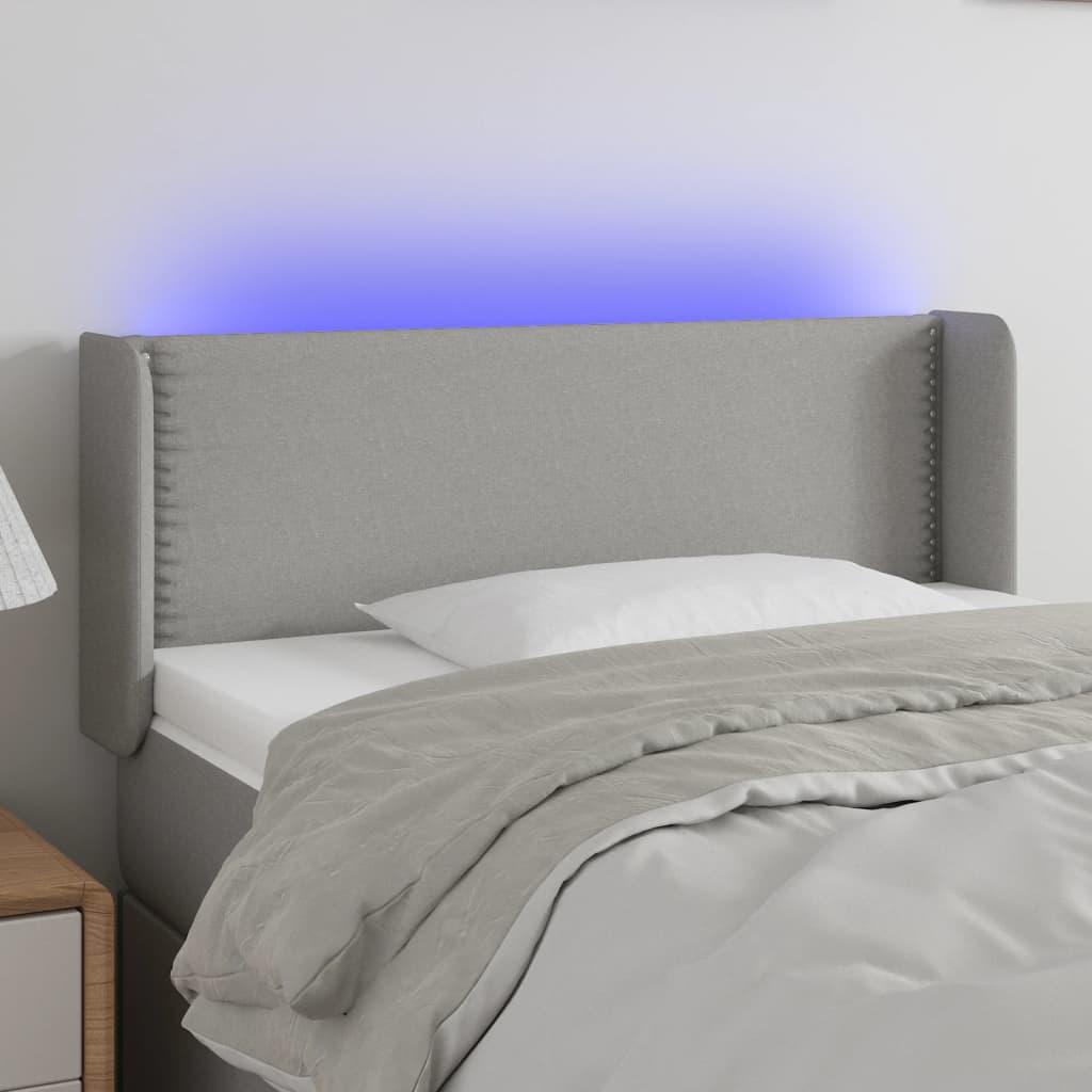 Sengegavl med LED-lys 83x16x78/88 cm stof lysegrå billede