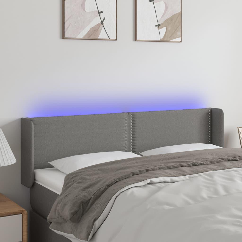 Sengegavl med LED-lys 147x16x78/88 cm stof mørkegrå billede