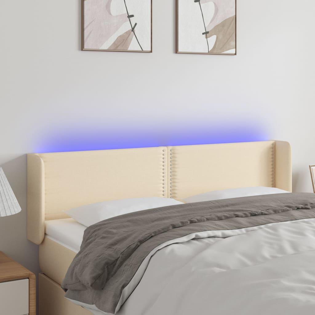 Sengegavl med LED-lys 147x16x78/88 cm stof cremefarvet billede