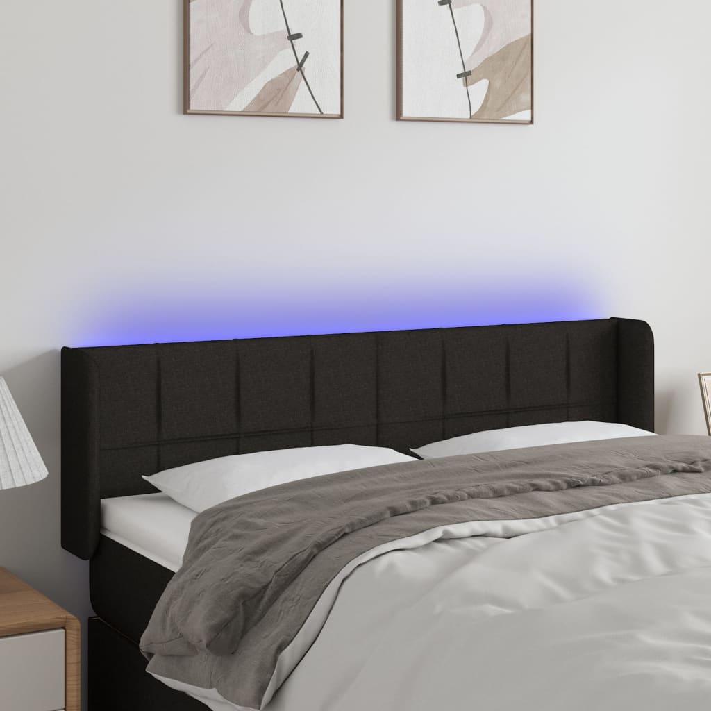 Sengegavl med LED-lys 147x16x78/88 cm stof sort billede