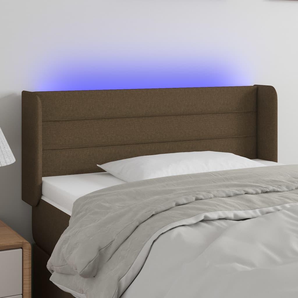 Sengegavl med LED-lys 103x16x78/88 cm stof mørkebrun billede