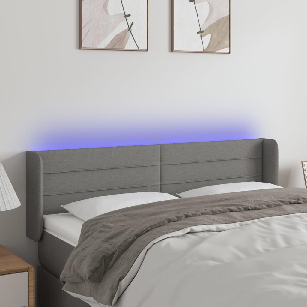 Sengegavl med LED-lys 147x16x78/88 cm stof mørkegrå billede
