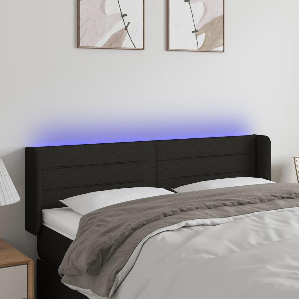 Sengegavl med LED-lys 147x16x78/88 cm stof sort billede