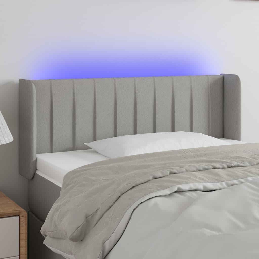 Sengegavl med LED-lys 103x16x78/88 cm stof lysegrå billede