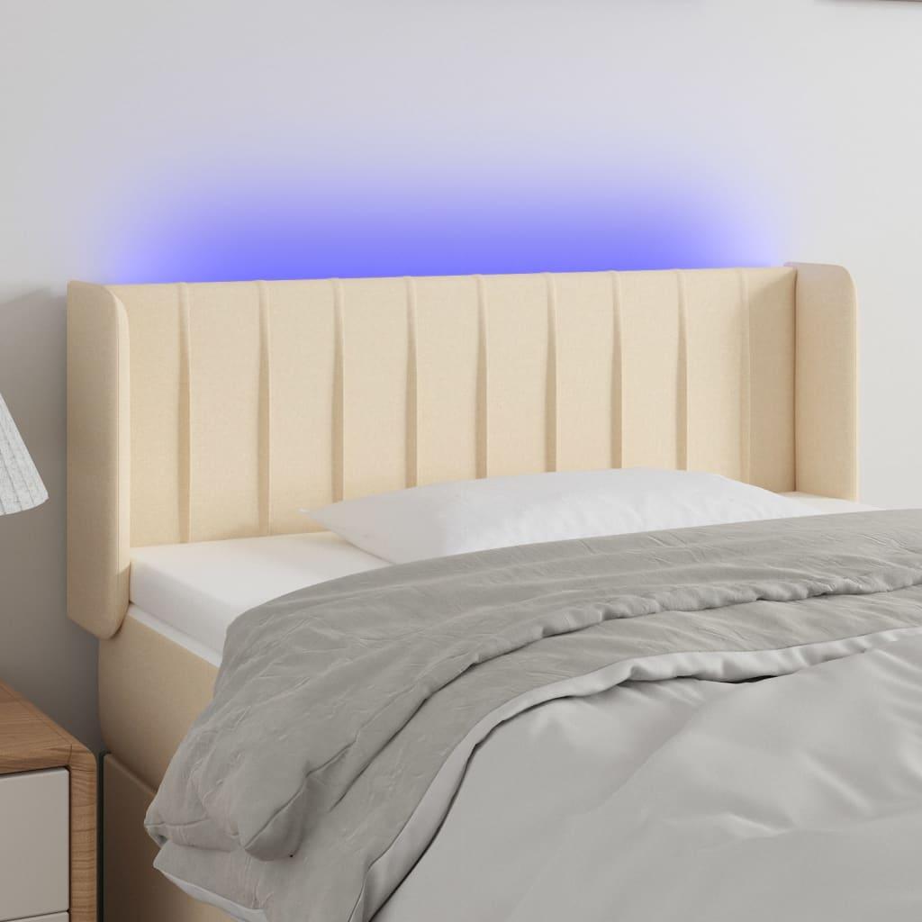 Sengegavl med LED-lys 103x16x78/88 cm stof cremefarvet billede