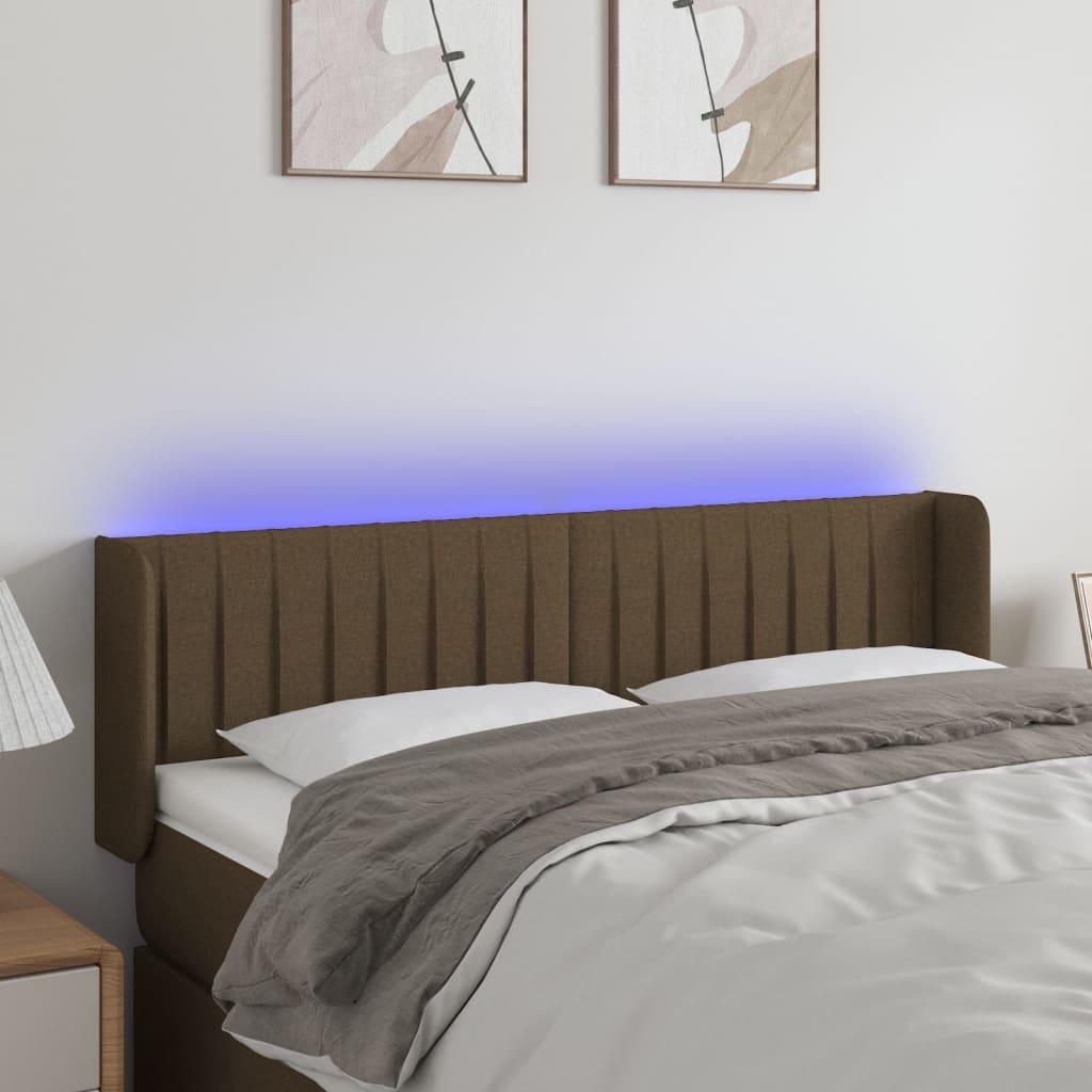 Sengegavl med LED-lys 147x16x78/88 cm stof mørkebrun billede