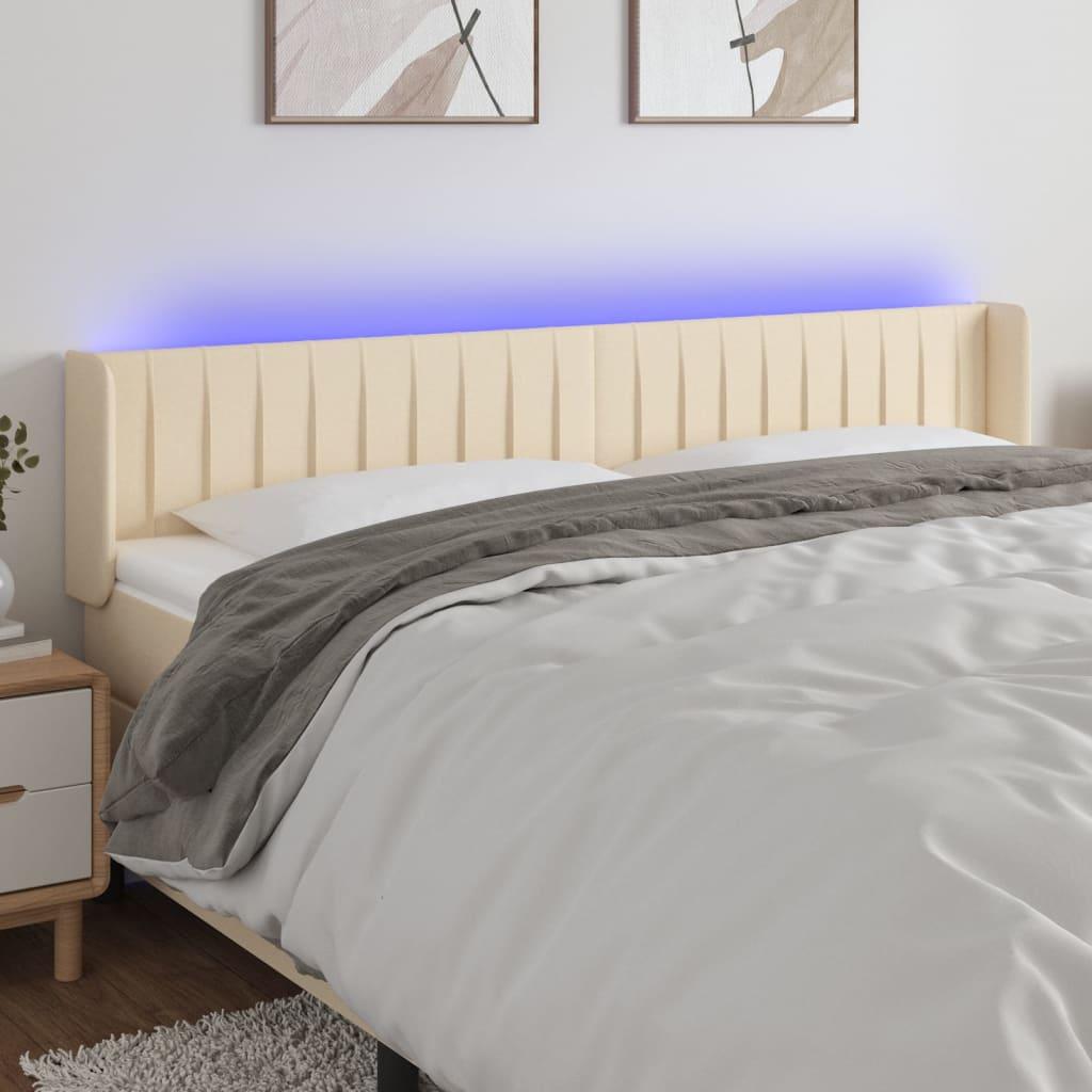 Sengegavl med LED-lys 163x16x78/88 cm stof cremefarvet billede
