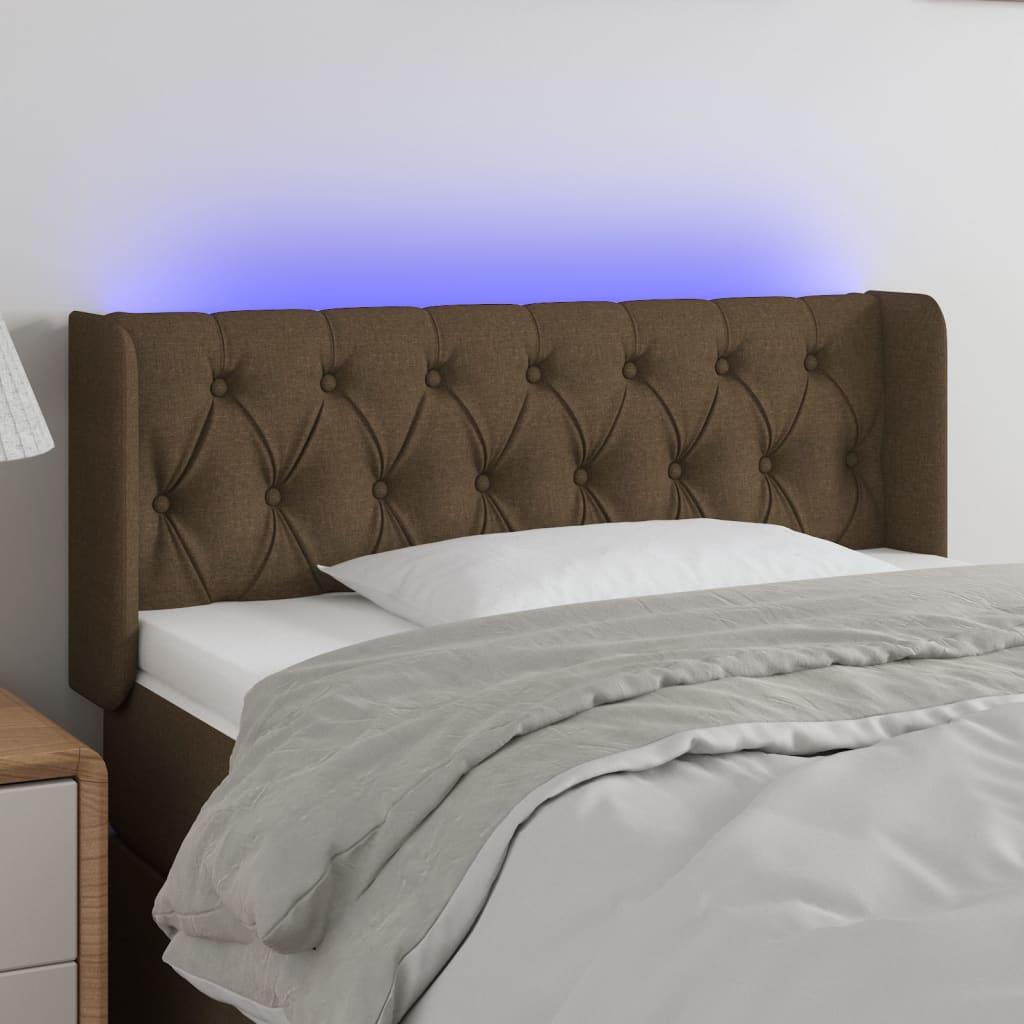 Sengegavl med LED-lys 93x16x78/88 cm stof mørkebrun billede
