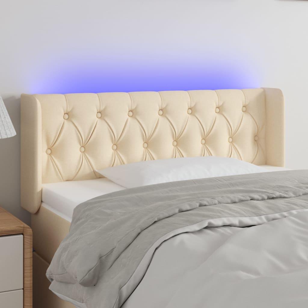 Sengegavl med LED-lys 103x16x78/88 cm stof cremefarvet billede