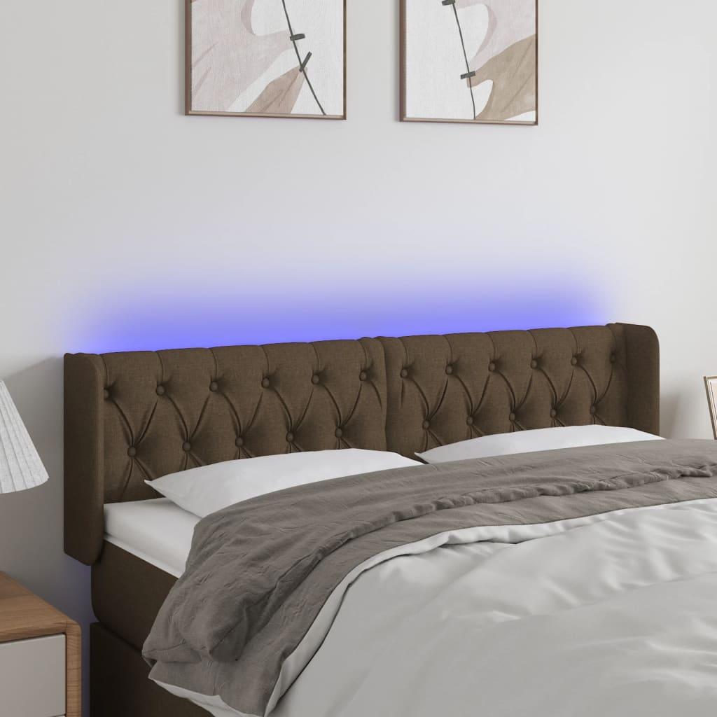 Sengegavl med LED-lys 147x16x78/88 cm stof mørkebrun billede