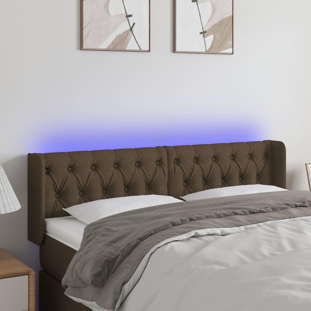 Sengegavl med LED-lys 163x16x78/88 cm stof mørkebrun billede