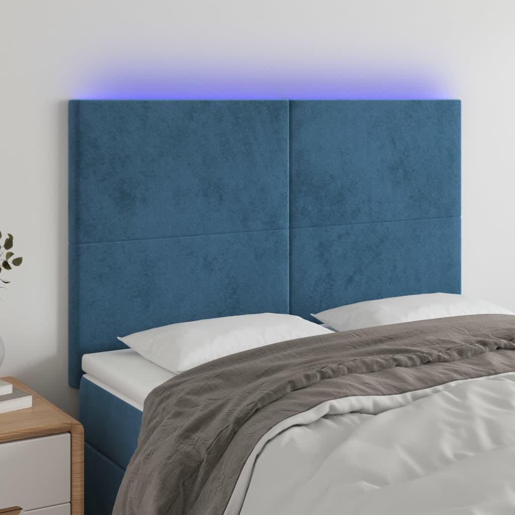 Sengegavl med LED-lys 144x5x118/128 cm fløjl mørkeblå billede