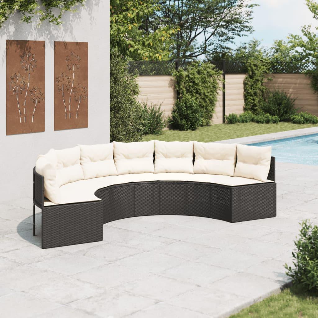 Halvrund havesofa i sort polyrattan med cremefarvede hynder billede