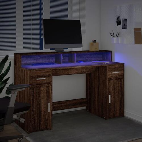 Skrivebord med LED-lys 140x55x91 cm konstrueret træ brunt eg