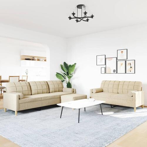 3 personers sofa med fodskammel og pyntepuder stof cremefarvet