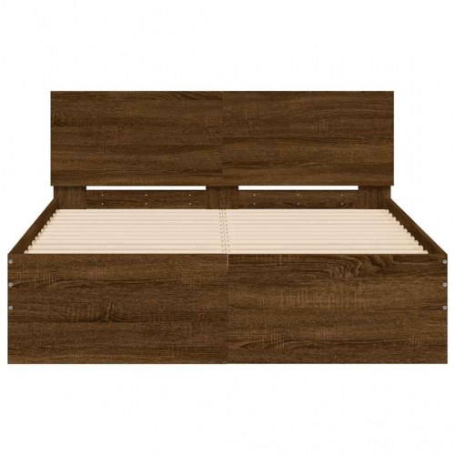 Sengeramme med sengegavl og LED-lys 135x190 cm brunt egetræ
