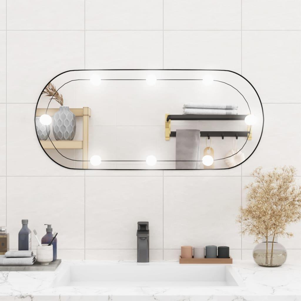 Se Vægspejl med LED-lys 35x80 cm oval glas hos Boligcenter.dk