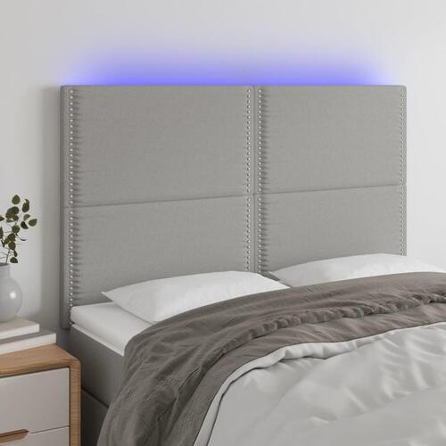 Sengegavl med LED-lys 144x5x118/128 cm stof lysegrå