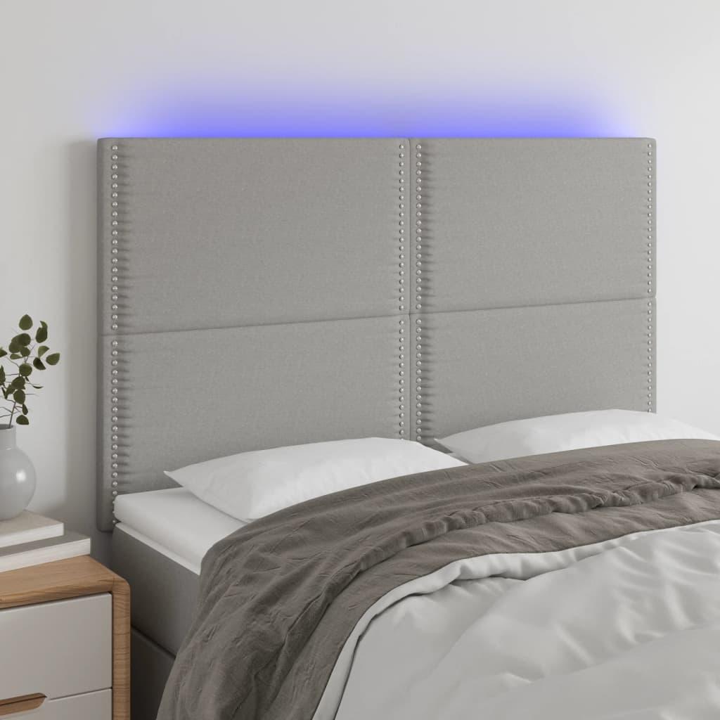 Sengegavl med LED-lys 144x5x118/128 cm stof lysegrå