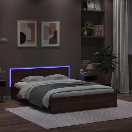 Sengeramme med sengegavl og LED-lys 150x200 cm brunt egetræ
