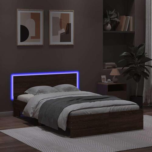 Sengeramme med sengegavl og LED-lys 120x190 cm brunt egetræ